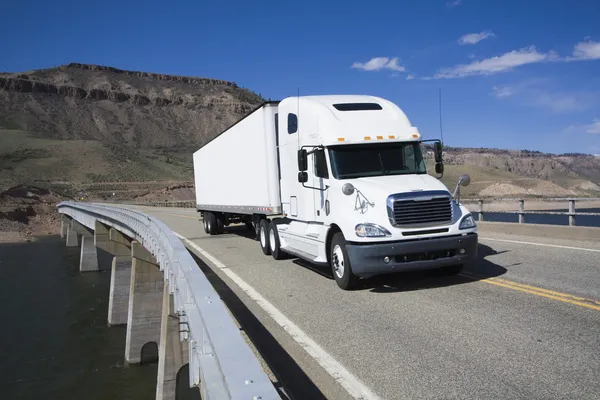 depositphotos_3595675-stock-photo-white-semi-driving-the-bridge